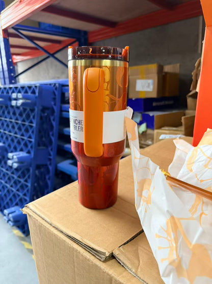 Stanley 1913 x KAROL G 40oz Quencher H2.O FlowState insulated tumbler with a sleek design and durable construction.