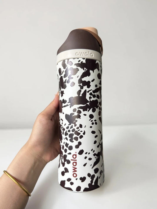The "Cowgirl Core" Owala Special Edition 24oz FreeSip Animal Print Cow Brown